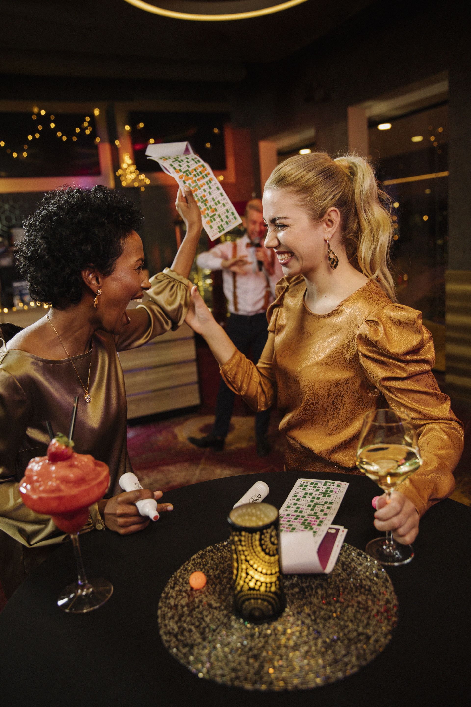 Two women having fun while playing bingo